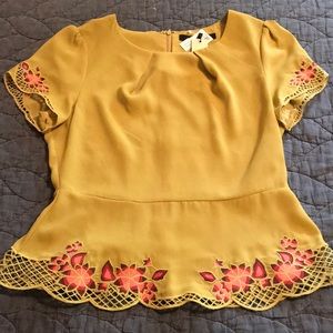 Short sleeve peplum blouse size M
